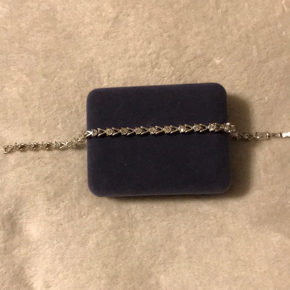 Silver and lab created white sapphire bracelet.